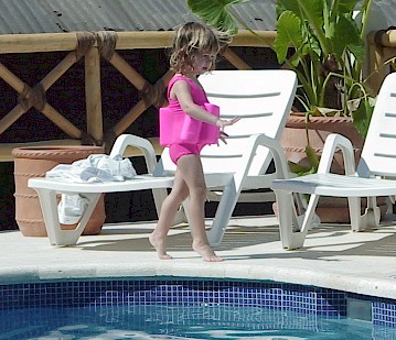 Tippie toe girl by the pool 1.jpg (51388 bytes)